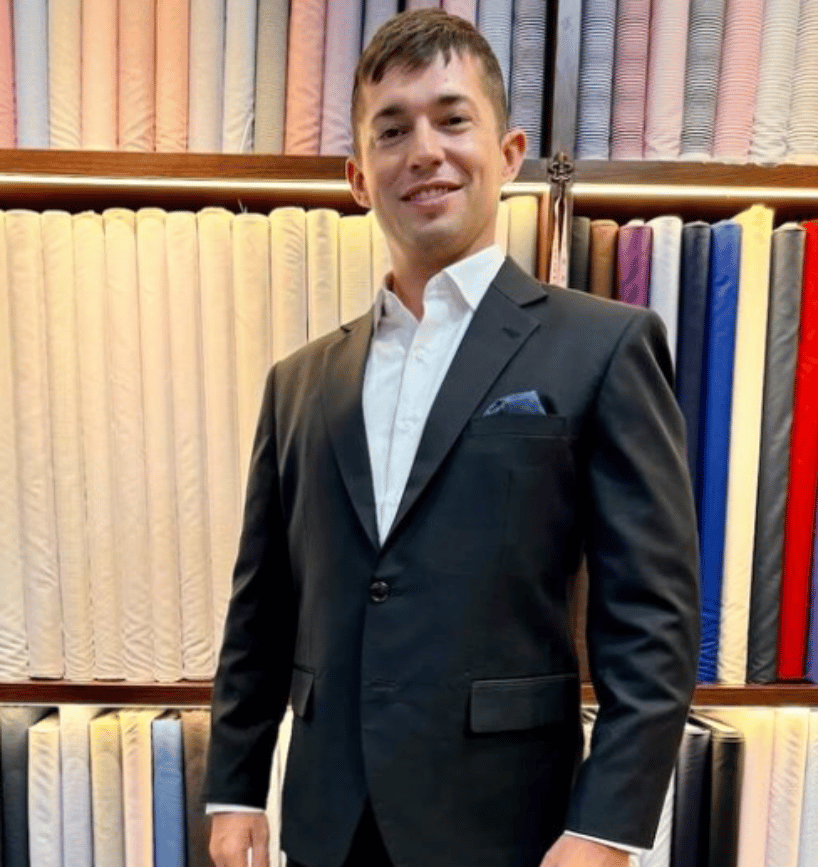 A handsome man wearing the suit made by Class Bespoke Tailor