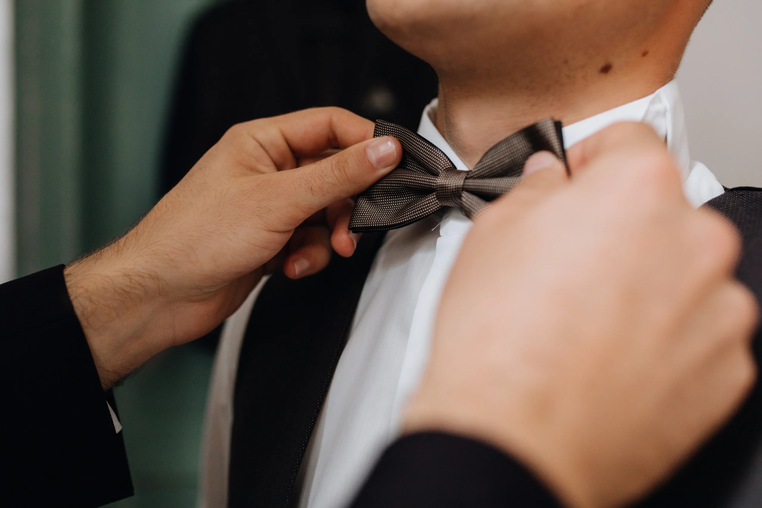 preparing-important-event-putting-bow-tie-front-view preparing-important-event-putting-bow-tie-front-view